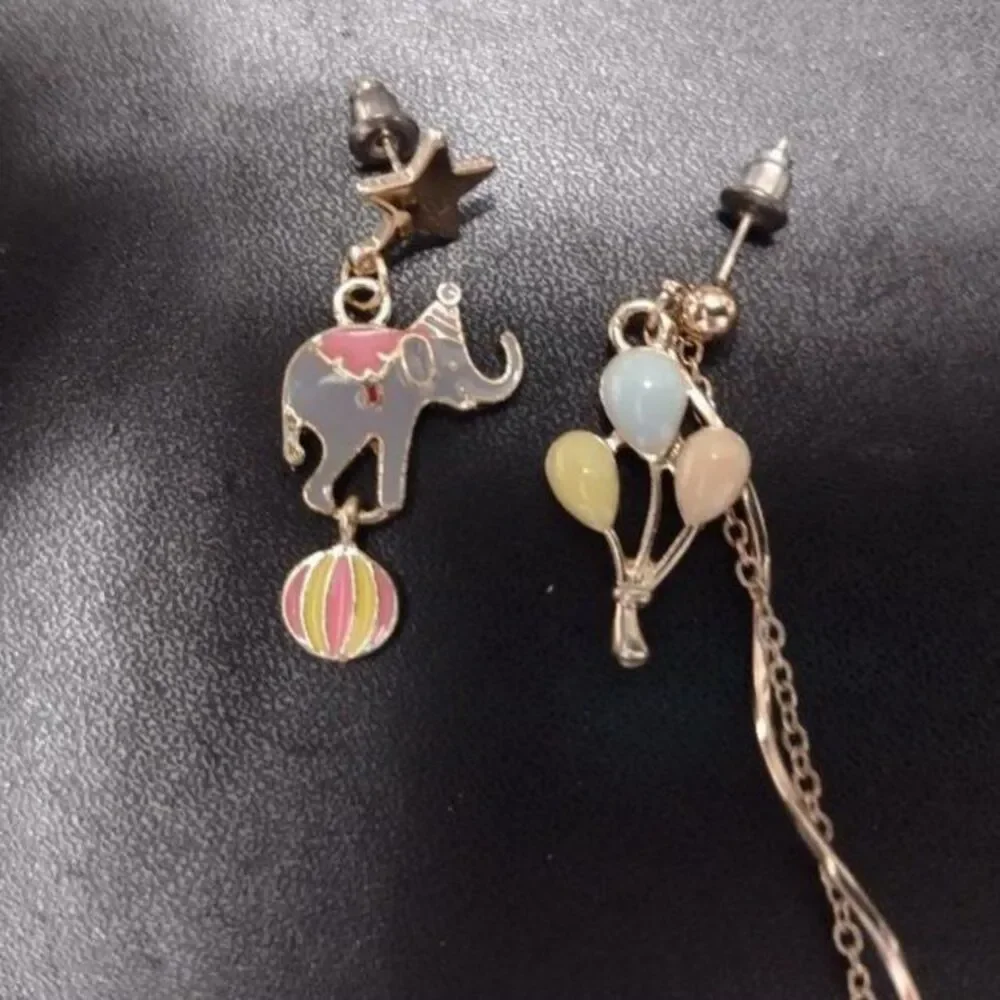 Circus high low earrings